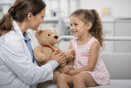 Pediatrician examining a child at Bhalakh Medical Centre